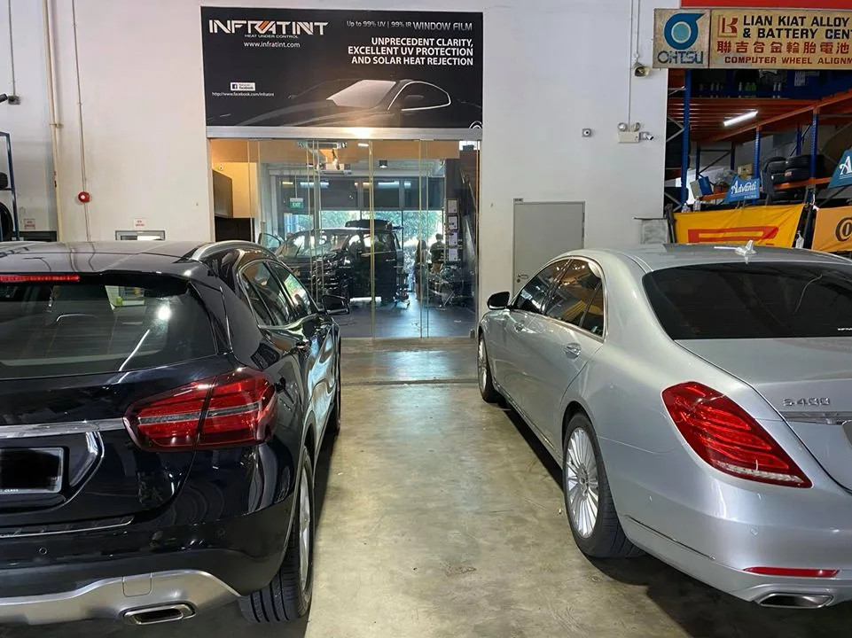 Black Mercedes-Benz GLA and silver S-Class parked in the bay at Infratint Singapore