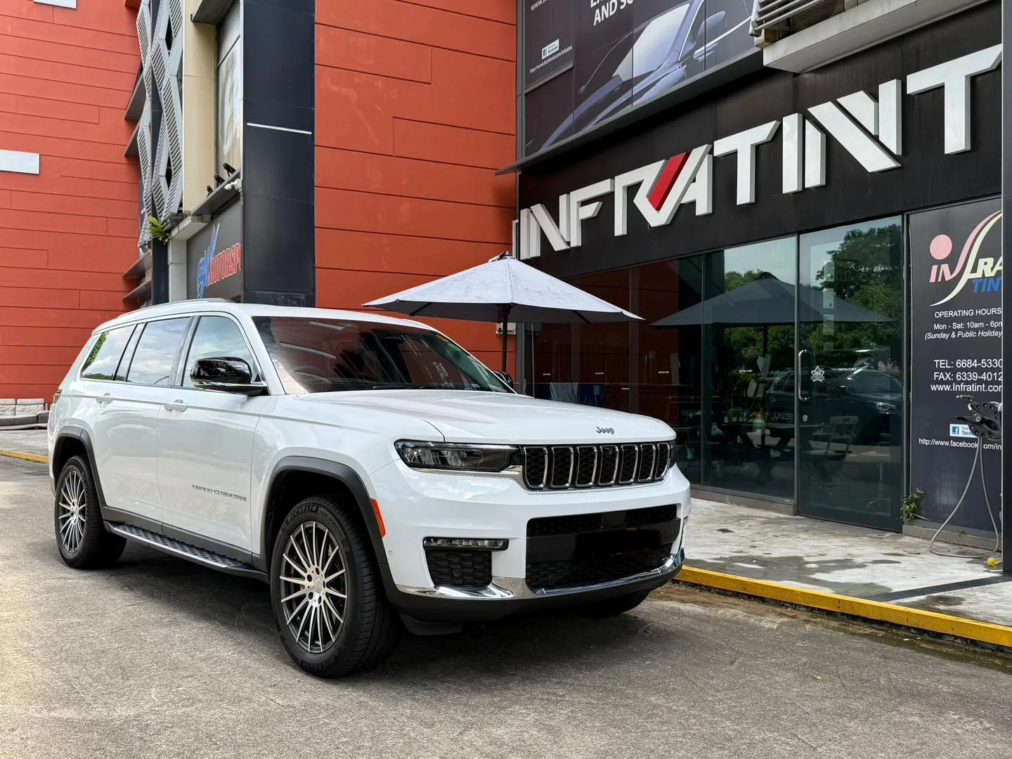Tinted white Jeep Cherokee front three-quarter view at Infratint Singapore