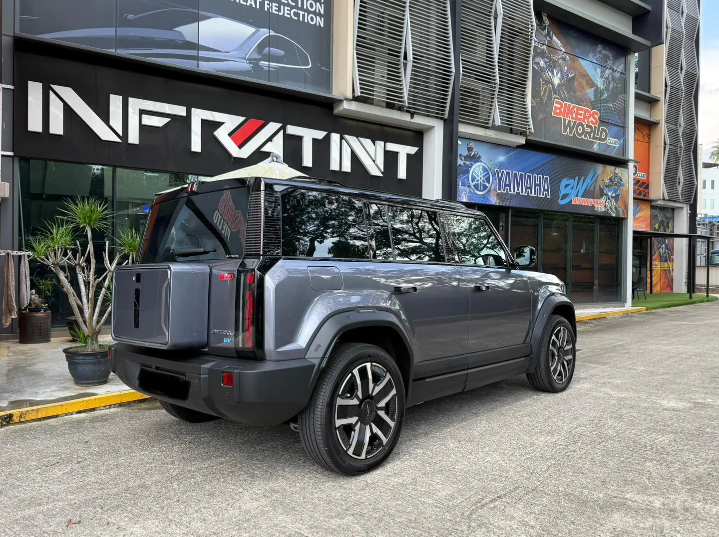 Grey Jaecoo J6 SUV rear three-quarter view with tinted tailgate at Infratint Singapore