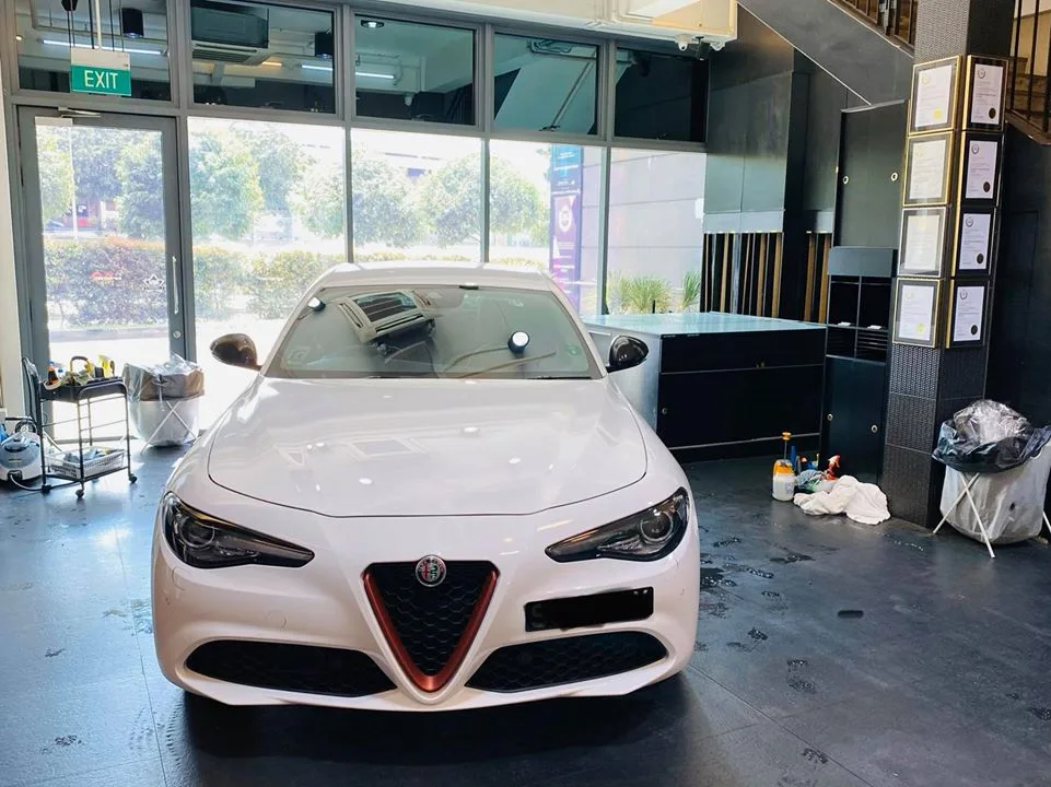 White Alfa Romeo Giulia front view after window tinting at Infratint Singapore