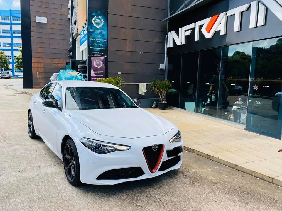 White Alfa Romeo Giulia front three-quarter outside Infratint Singapore