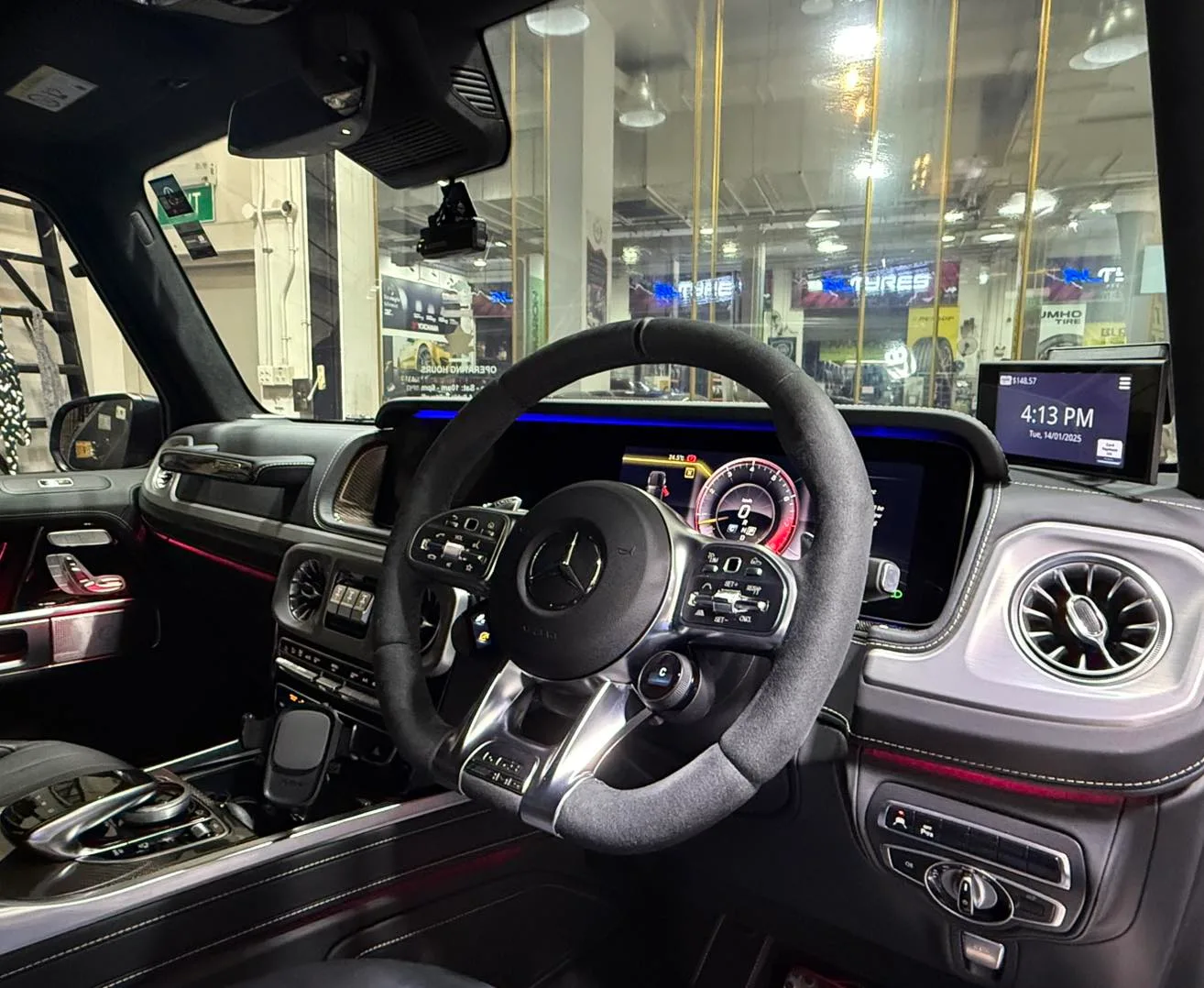 Mercedes-Benz G-Wagon interior steering wheel and dashboard seen through tinted glass at Infratint Singapore