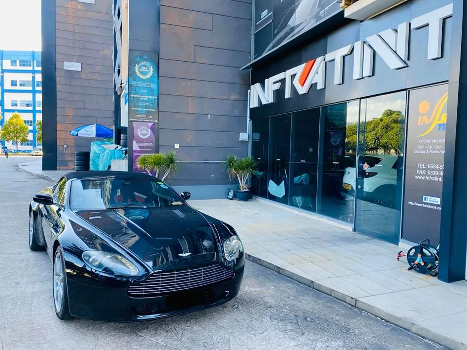 Black Aston Martin Vantage convertible outside the Infratint Singapore shopfront for window tinting