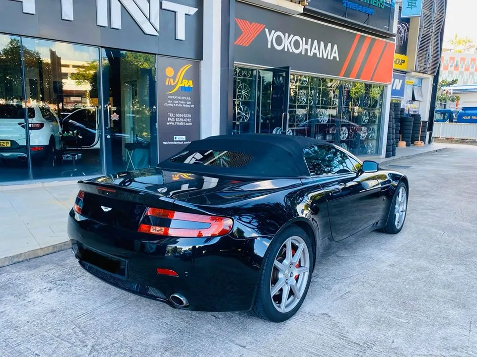 Rear view of a black Aston Martin Vantage convertible at Infratint Singapore