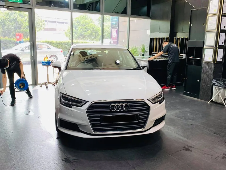 White Audi A3 front view during window tinting at Infratint Singapore