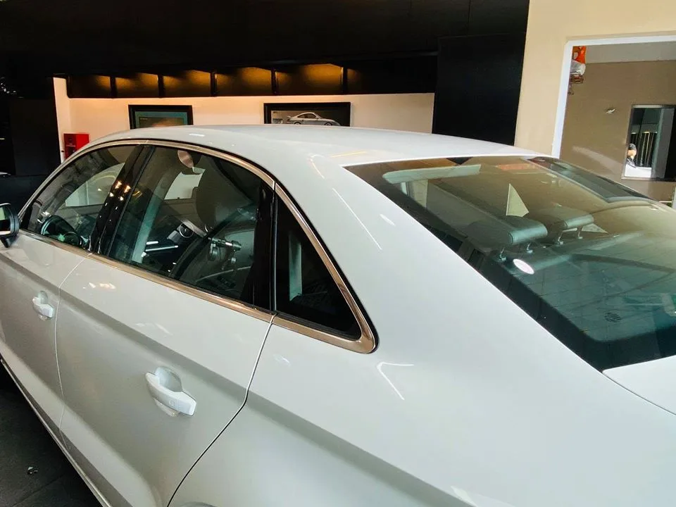 Close-up of the tinted rear windows on a white Audi sedan at Infratint Singapore