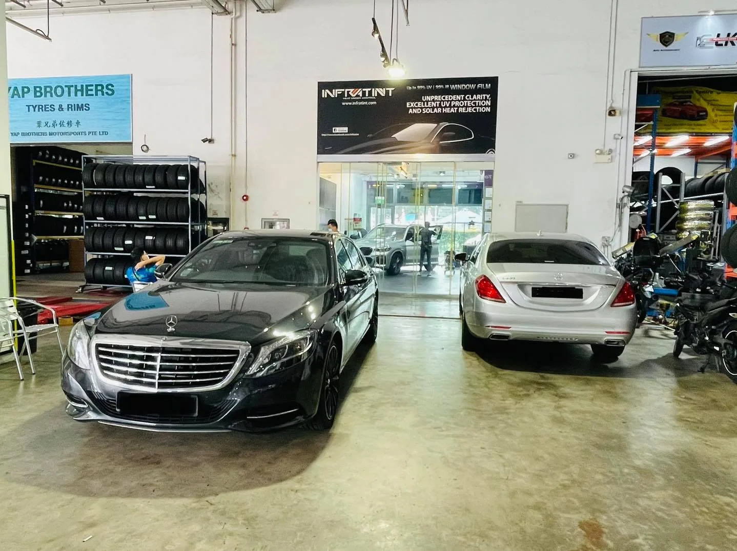Black and silver Mercedes-Benz sedans at Infratint Singapore install bay