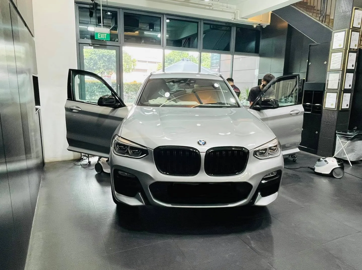Silver BMW SUV at Infratint Singapore for window film installation