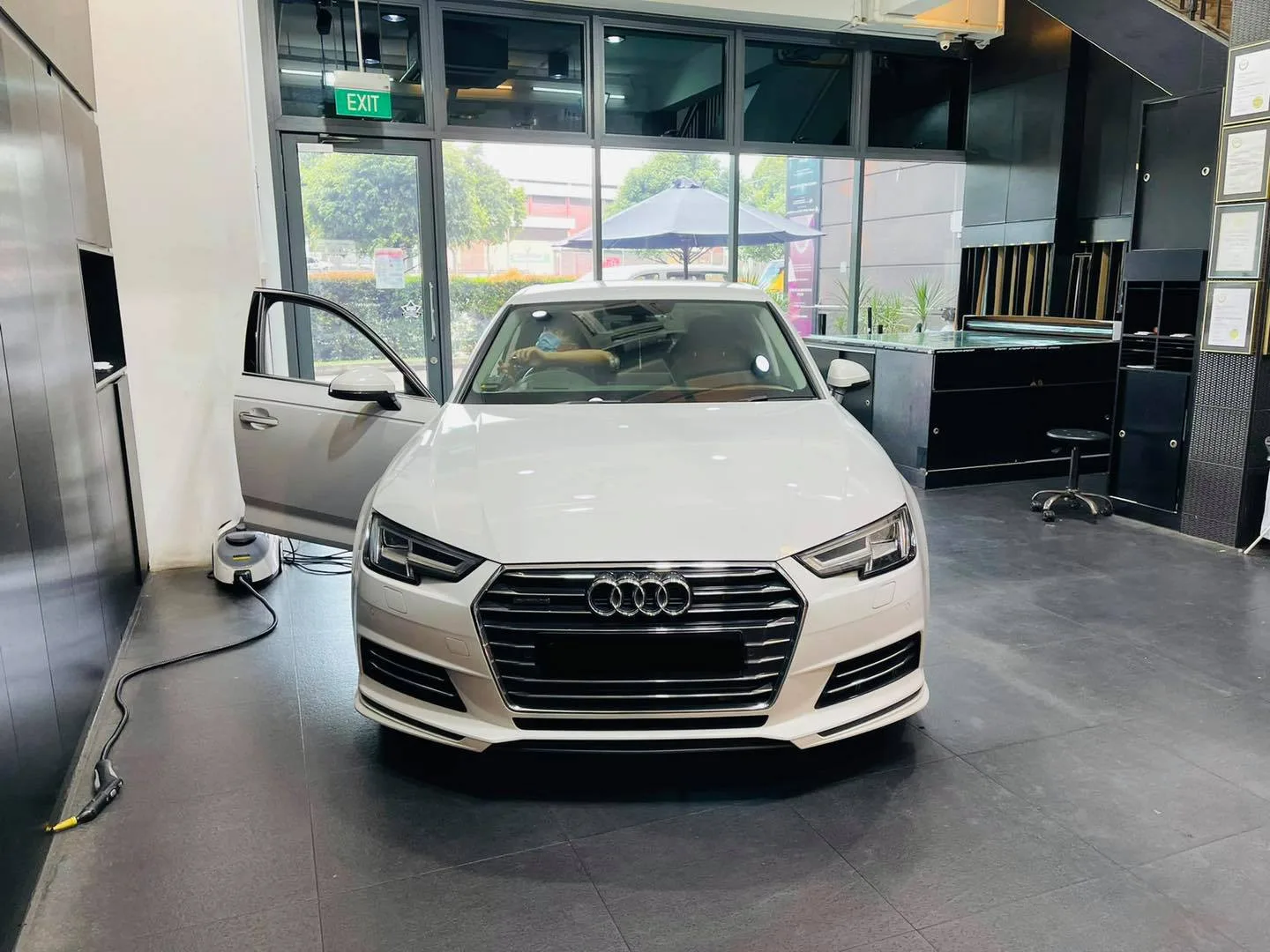White Audi sedan at Infratint Singapore for window tinting