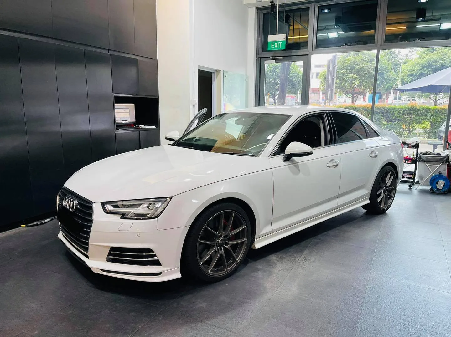 White Audi sedan front three-quarter at Infratint Singapore