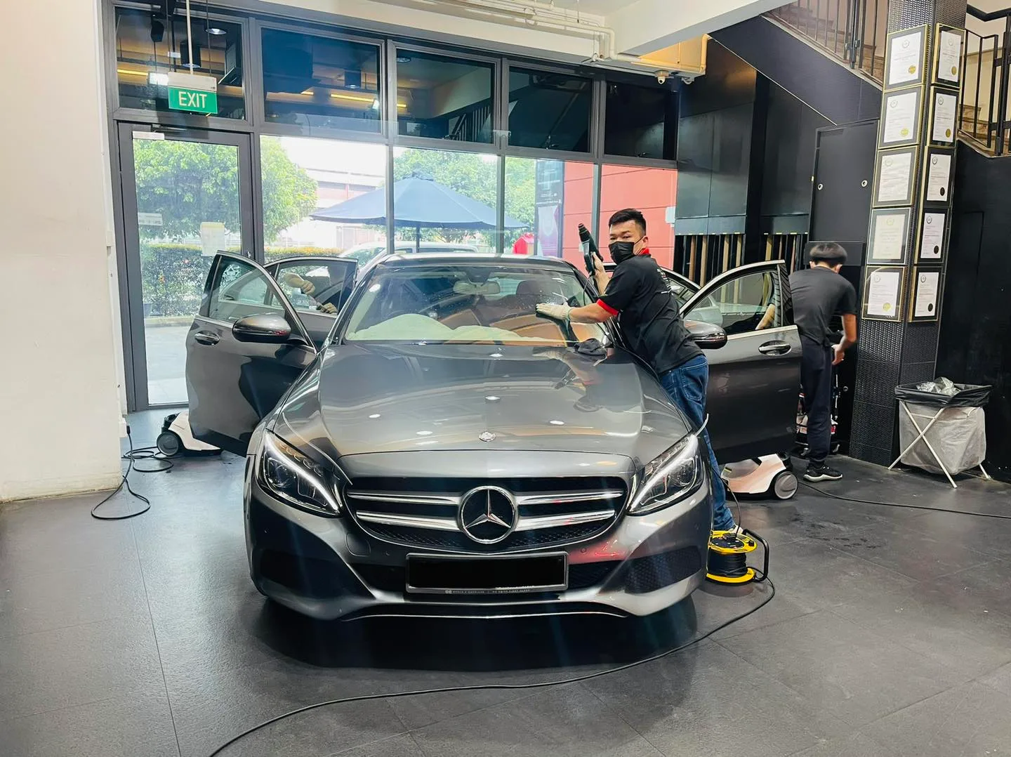 Grey Mercedes-Benz C-Class being prepared for window tinting at Infratint Singapore