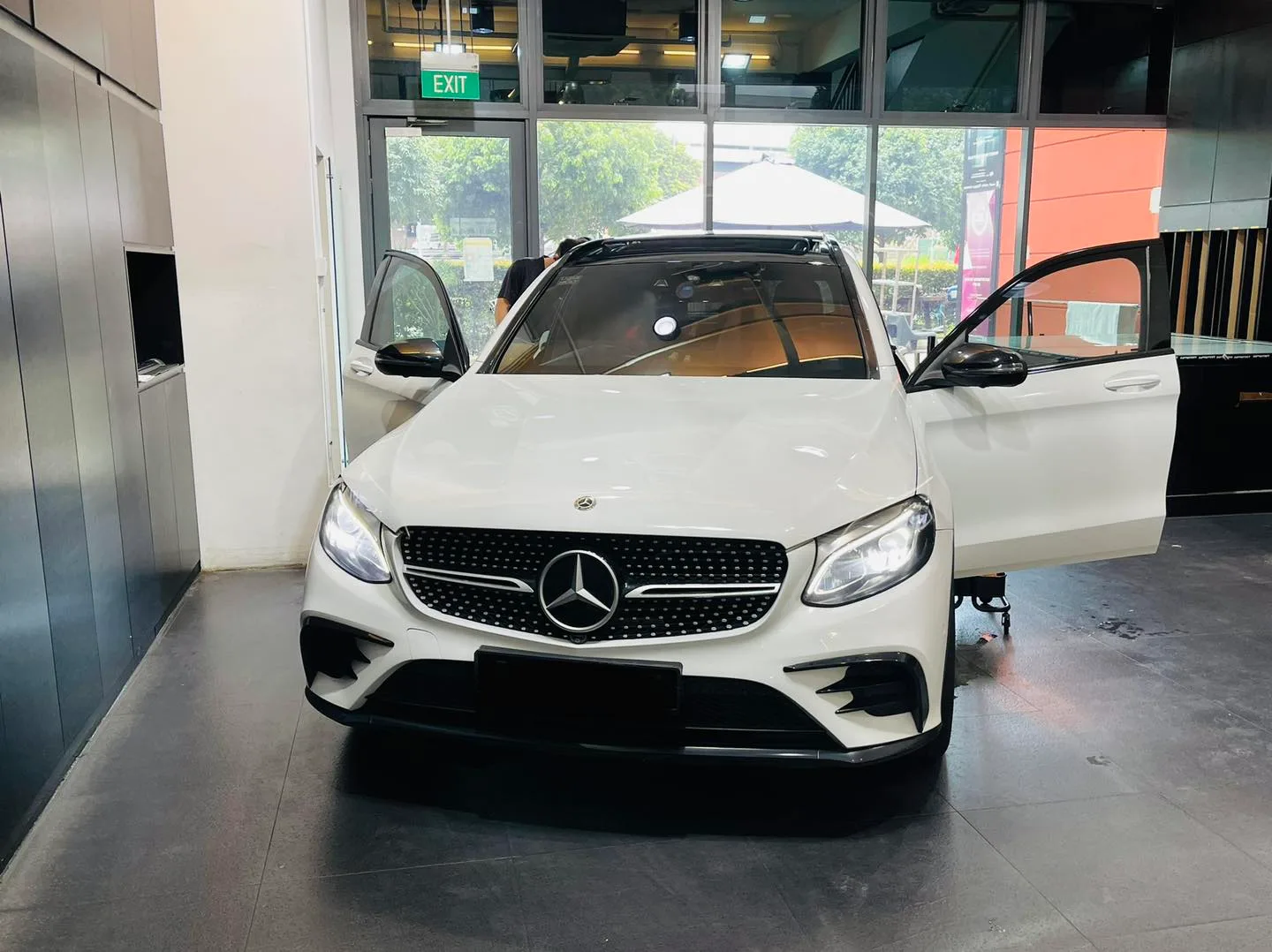 White Mercedes-Benz GLC SUV with doors open at Infratint Singapore for window film