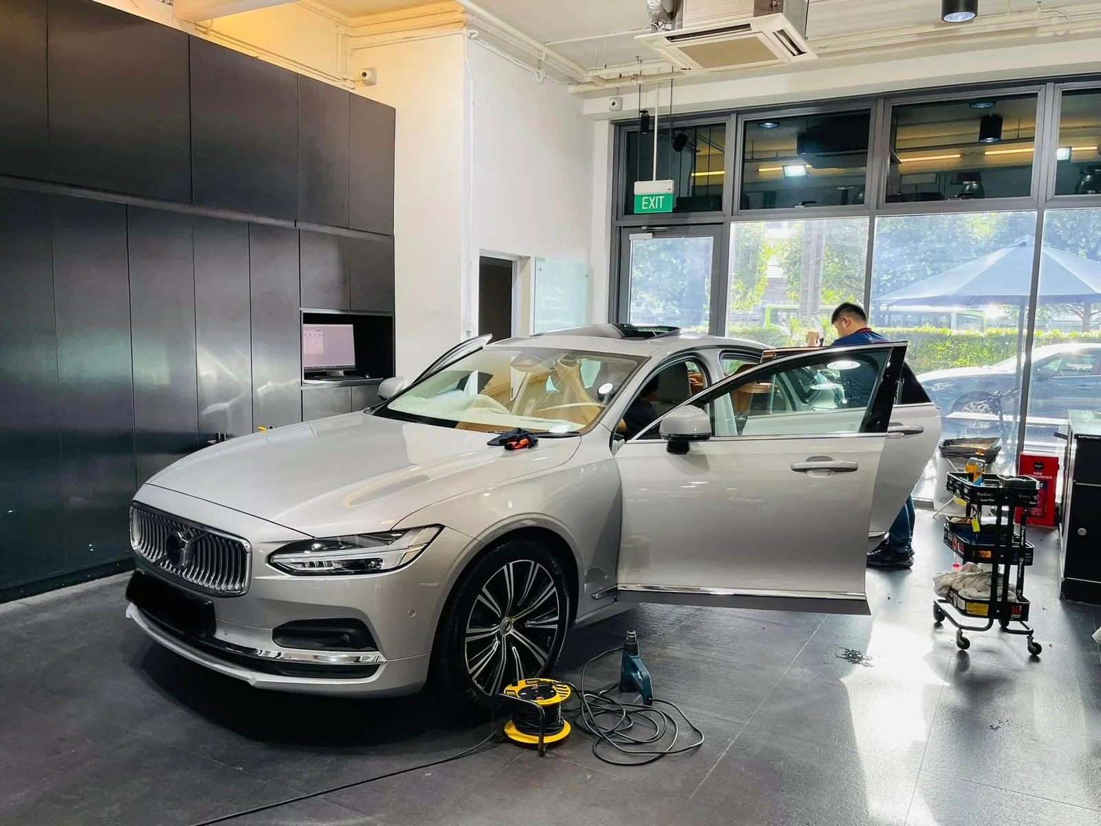 Silver Volvo S90 in profile during window tinting at Infratint Singapore
