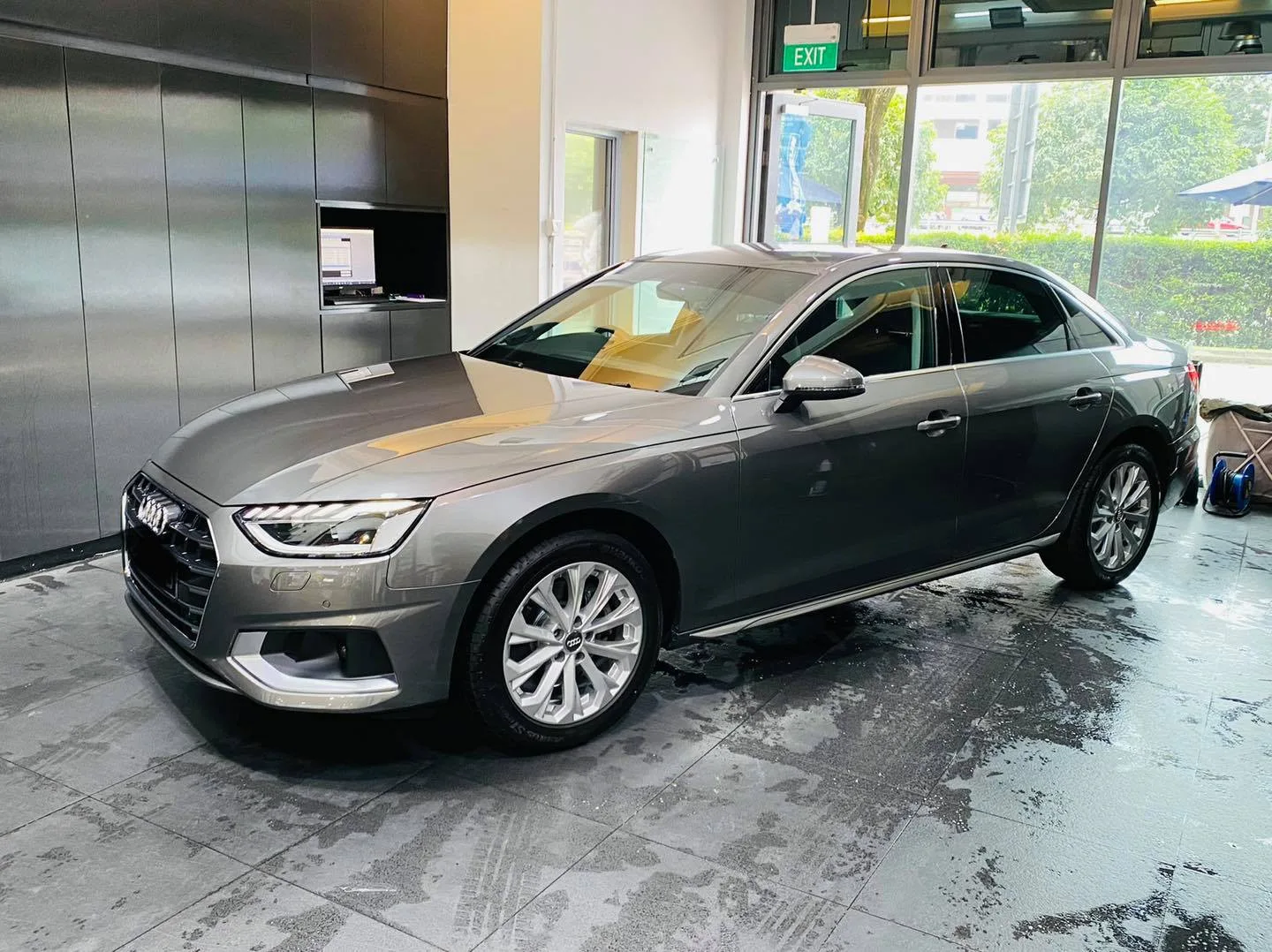Grey Audi A4 sedan front three-quarter view at Infratint Singapore window tinting