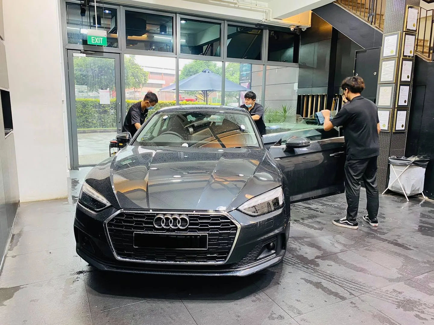 Dark grey Audi sportback during window film fitting at Infratint Singapore