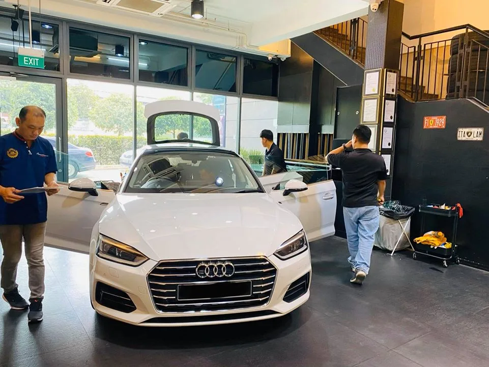 White Audi A5 Sportback front view with the boot open at Infratint Singapore for window tinting