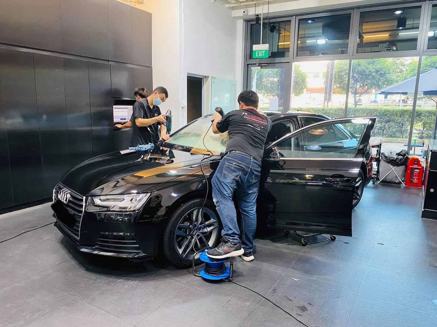 Black Audi sedan having side windows tinted at Infratint Singapore