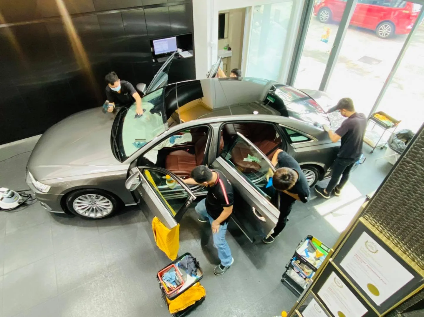 Overhead view of a grey Audi A8L being tinted by the team at Infratint Singapore