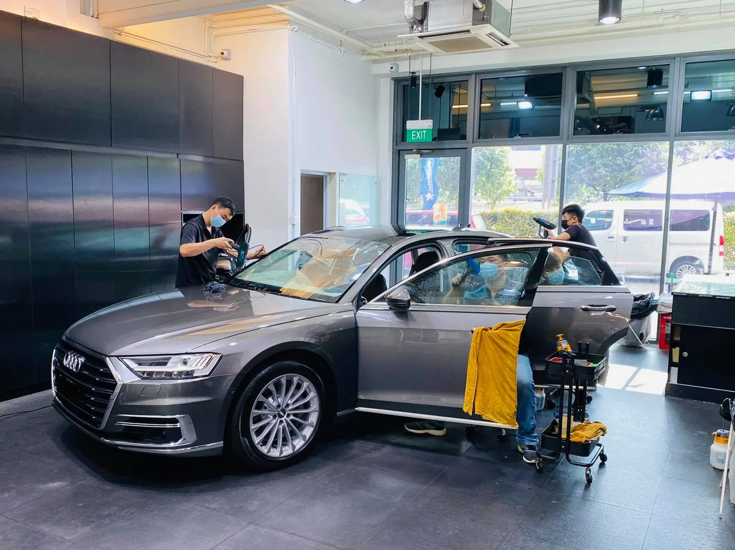 Grey Audi A8L sedan during window film install at Infratint Singapore