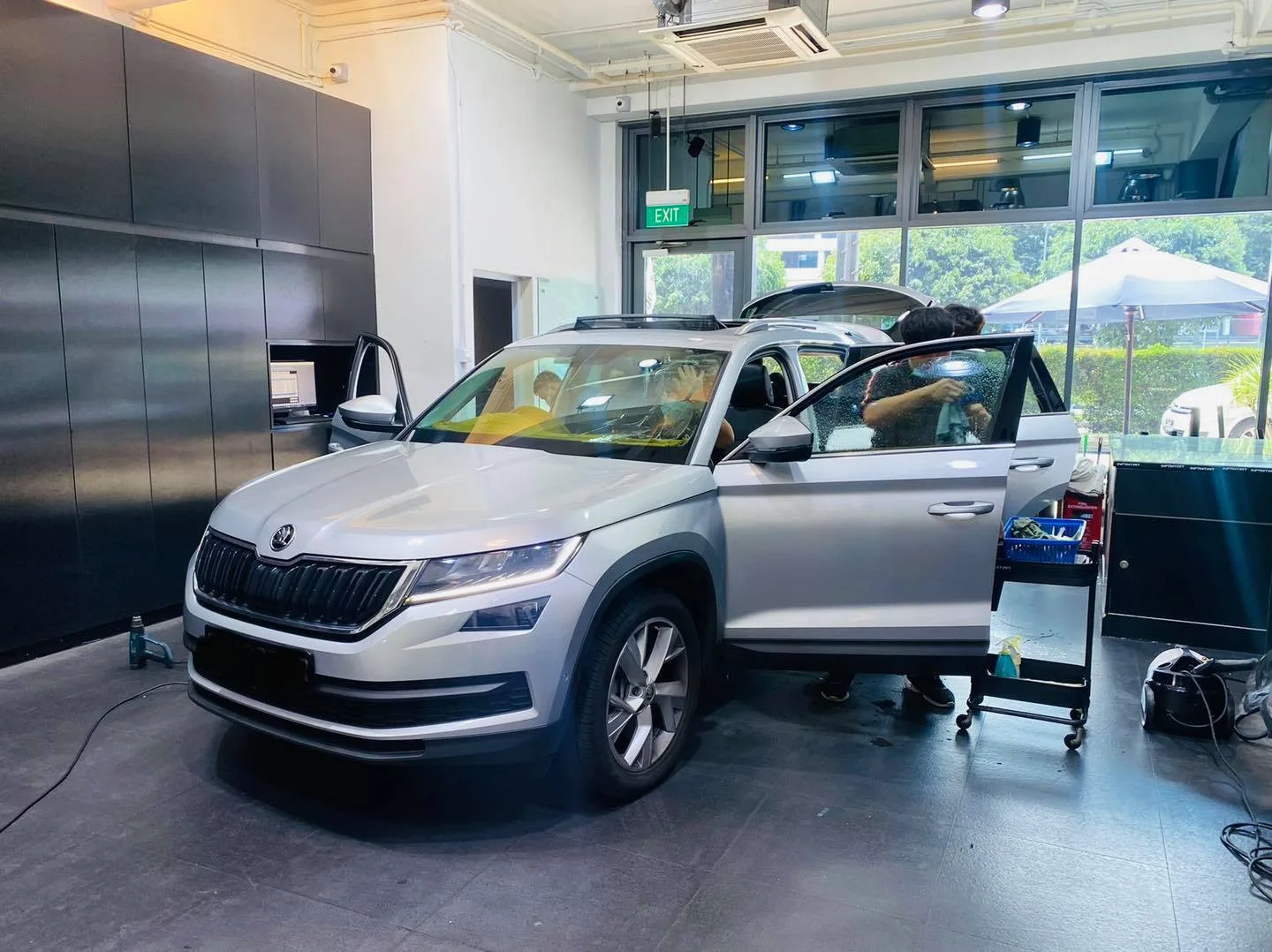 Silver Skoda Kodiaq front three-quarter during window film install at Infratint Singapore