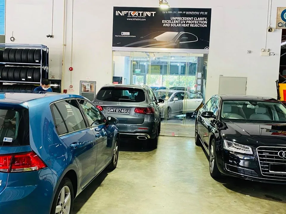 Blue VW Golf, grey Mercedes-Benz GLC and black Audi A8 lined up at Infratint Singapore