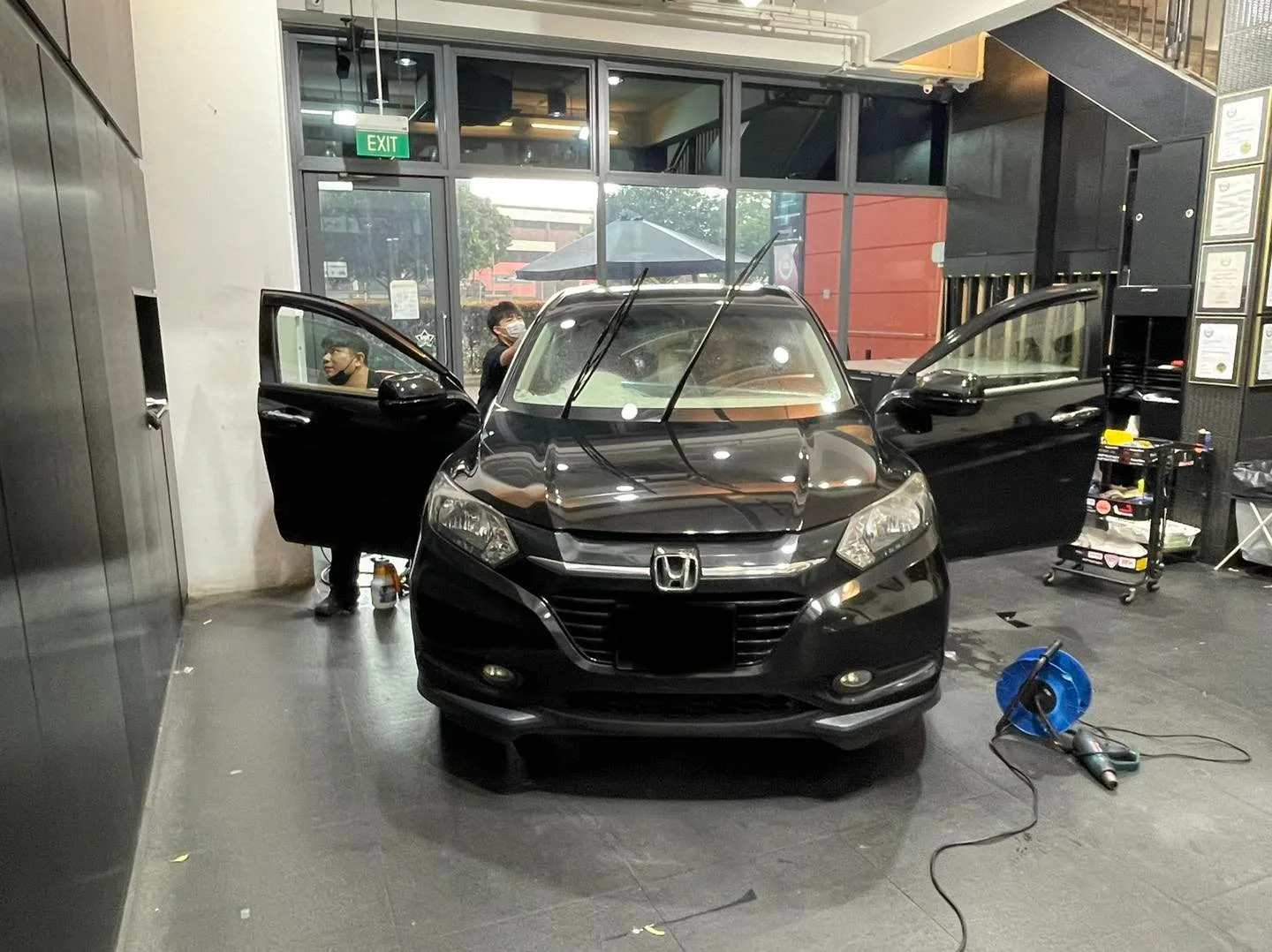 Black Honda Vezel prepped for window tinting at Infratint Singapore