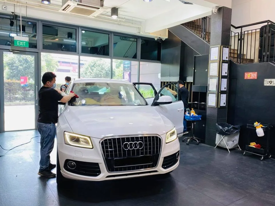 White Audi Q5 SUV during window tinting at Infratint Singapore