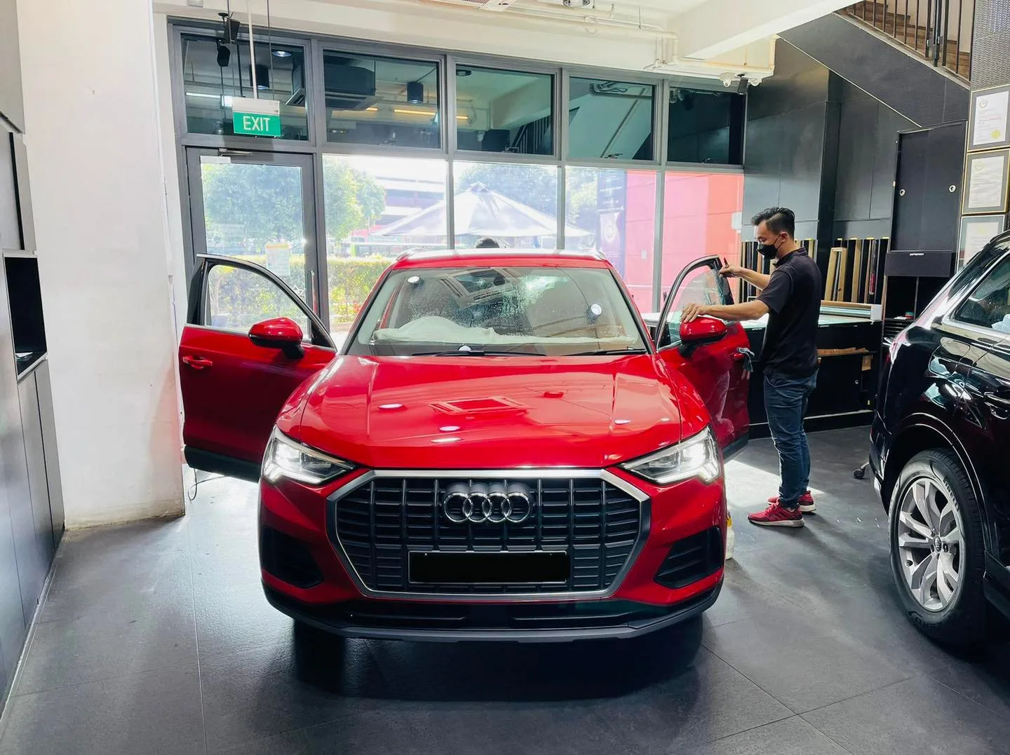 Red Audi SUV having its windows tinted at Infratint Singapore