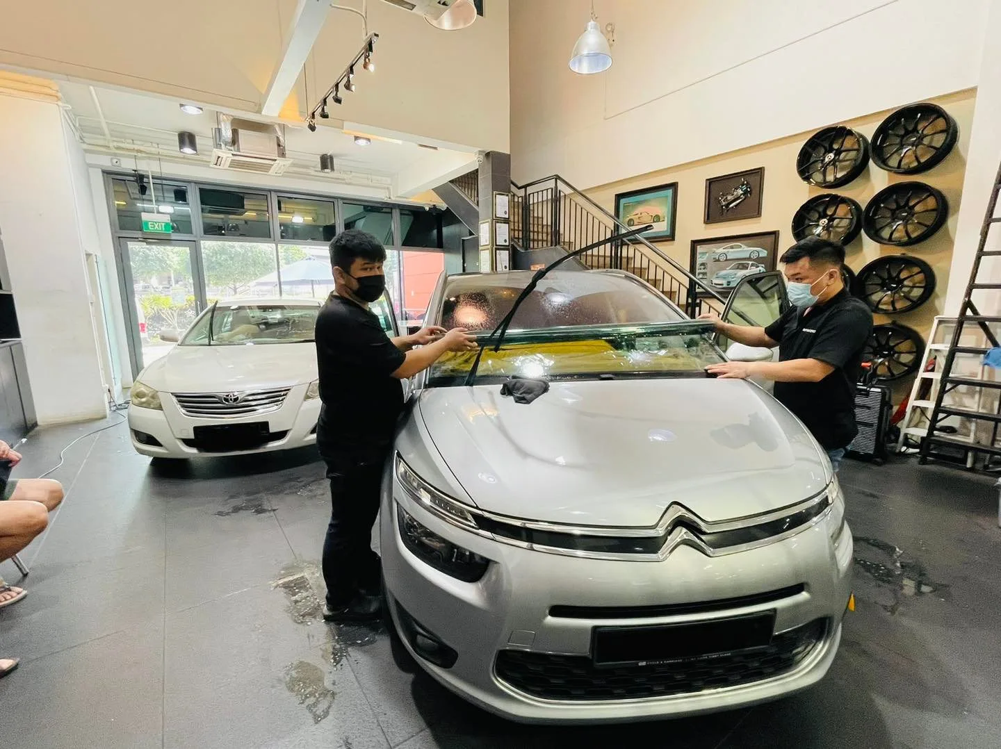 Silver Citroen being tinted by two installers at Infratint Singapore