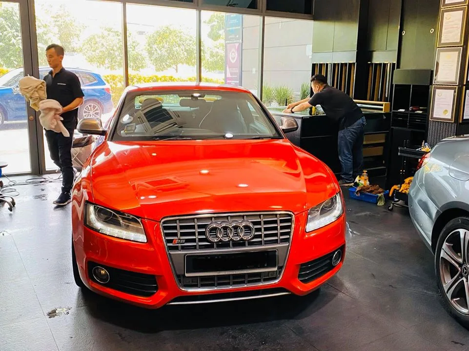 Red Audi S5 being prepared for window tinting at Infratint Singapore