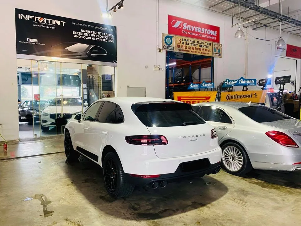 White Porsche Macan and silver Mercedes-Benz S-Class at Infratint Singapore