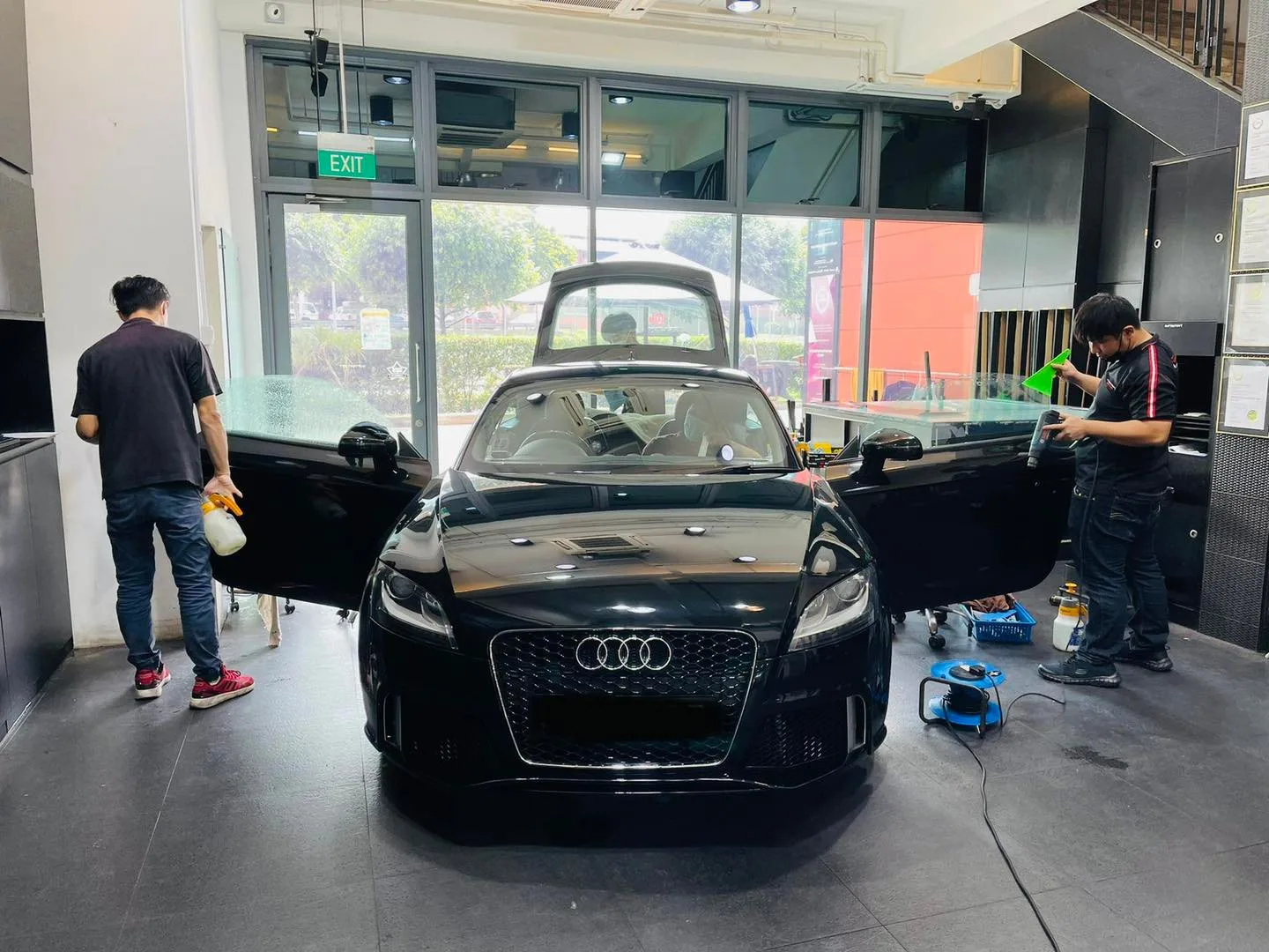 Black Audi TT coupe being prepped for window film at Infratint Singapore