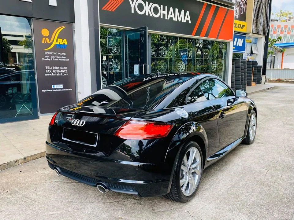 Black Audi TT coupe seen from the rear three-quarter outside Infratint Singapore