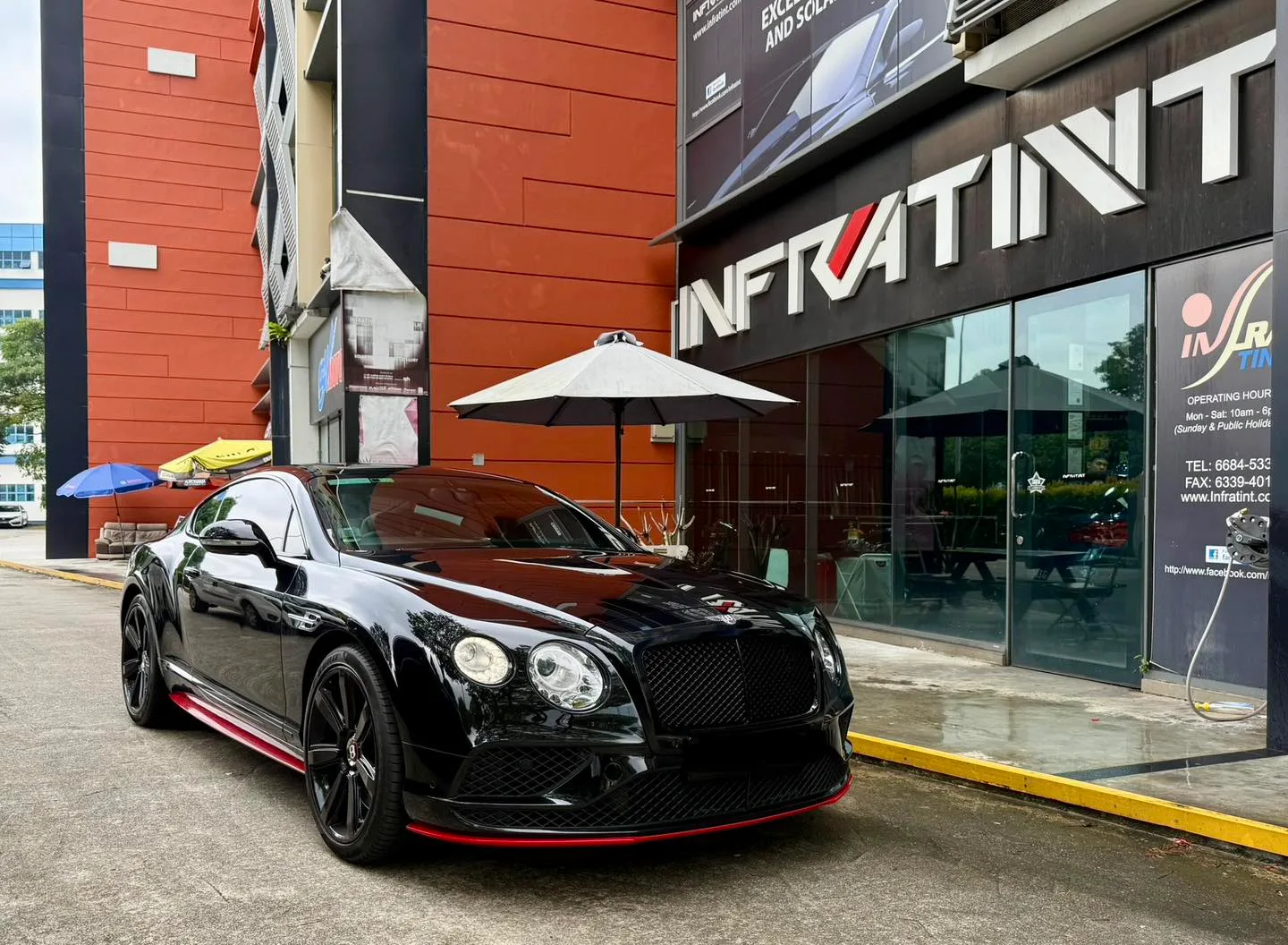 Black Bentley GT front three-quarter view with tinted glass at Infratint Singapore