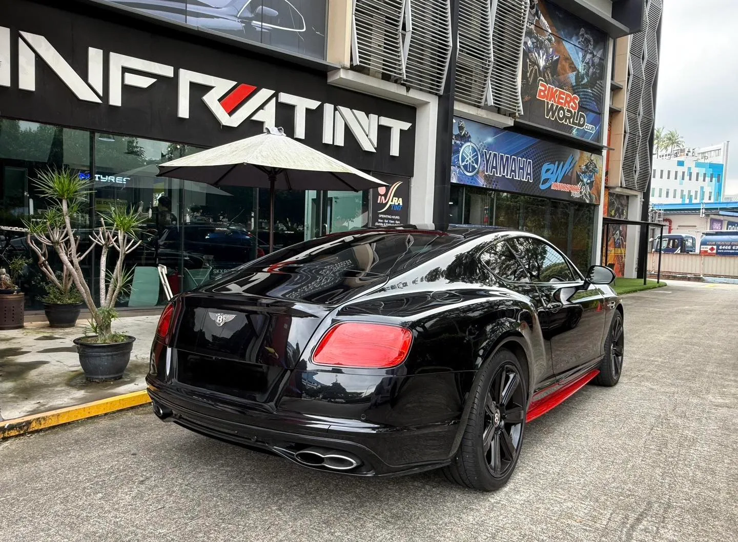Black Bentley GT rear three-quarter view with tinted glass at Infratint Singapore