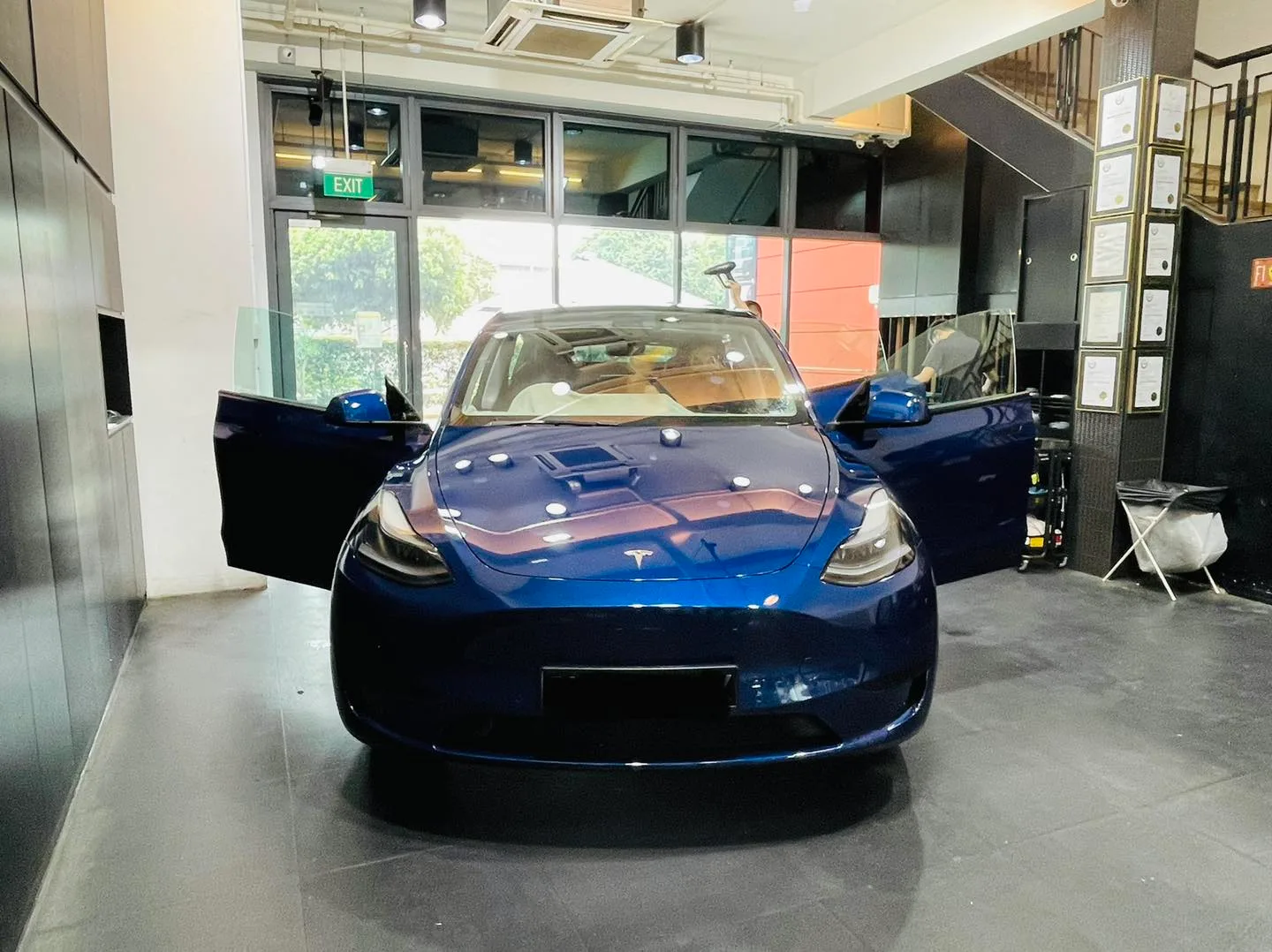 Blue Tesla Model Y front view at Infratint Singapore for window film