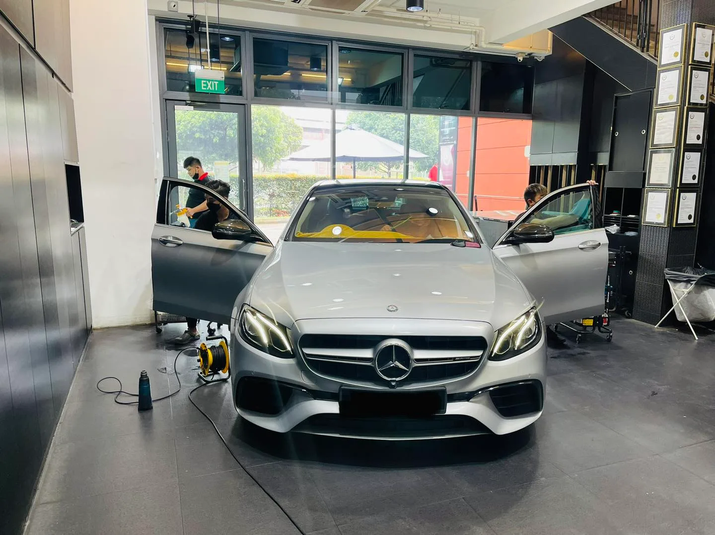 Silver Mercedes-Benz E-Class front view during window tinting at Infratint Singapore