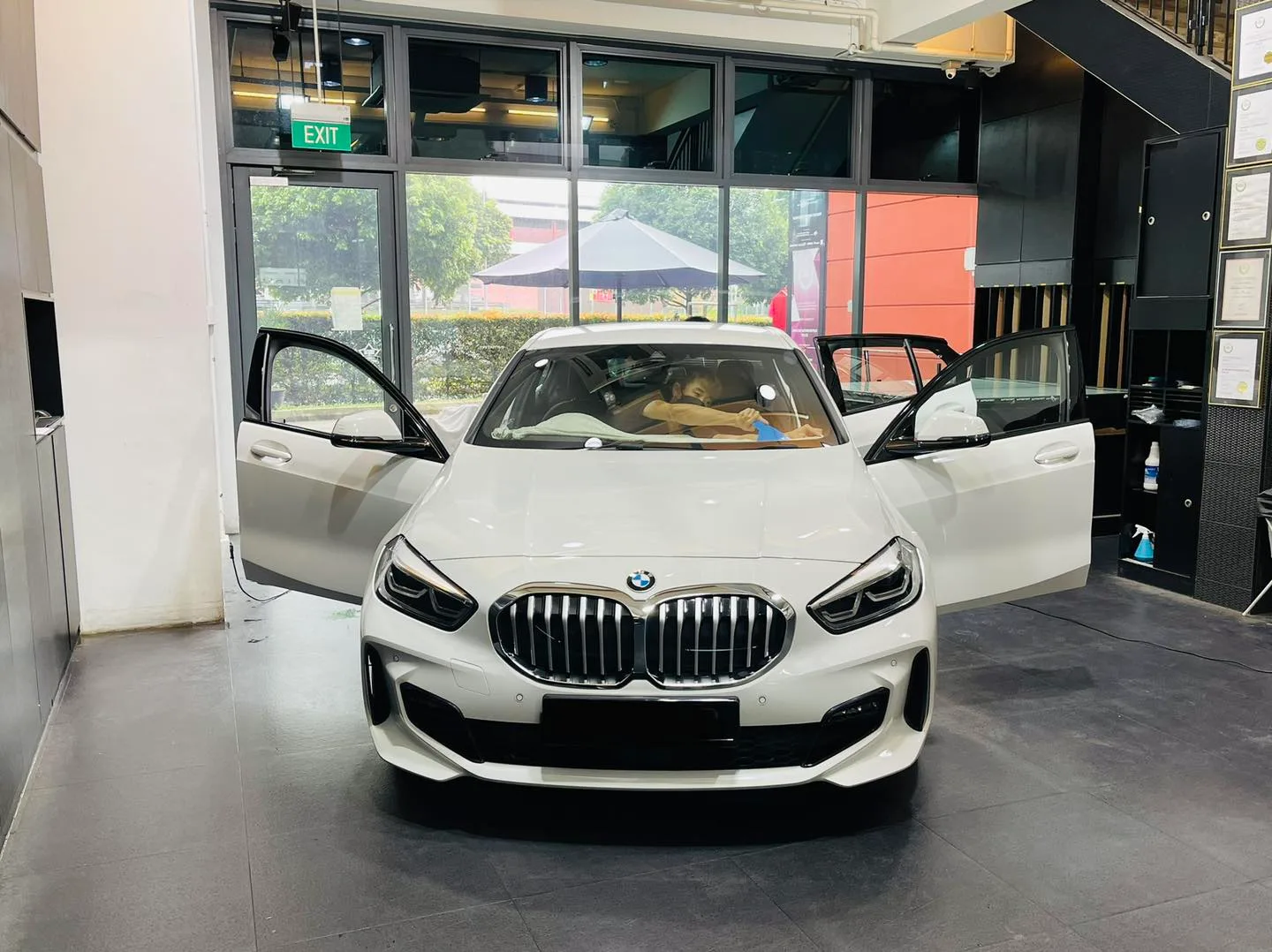 White BMW 1 Series front view at Infratint Singapore for window tinting