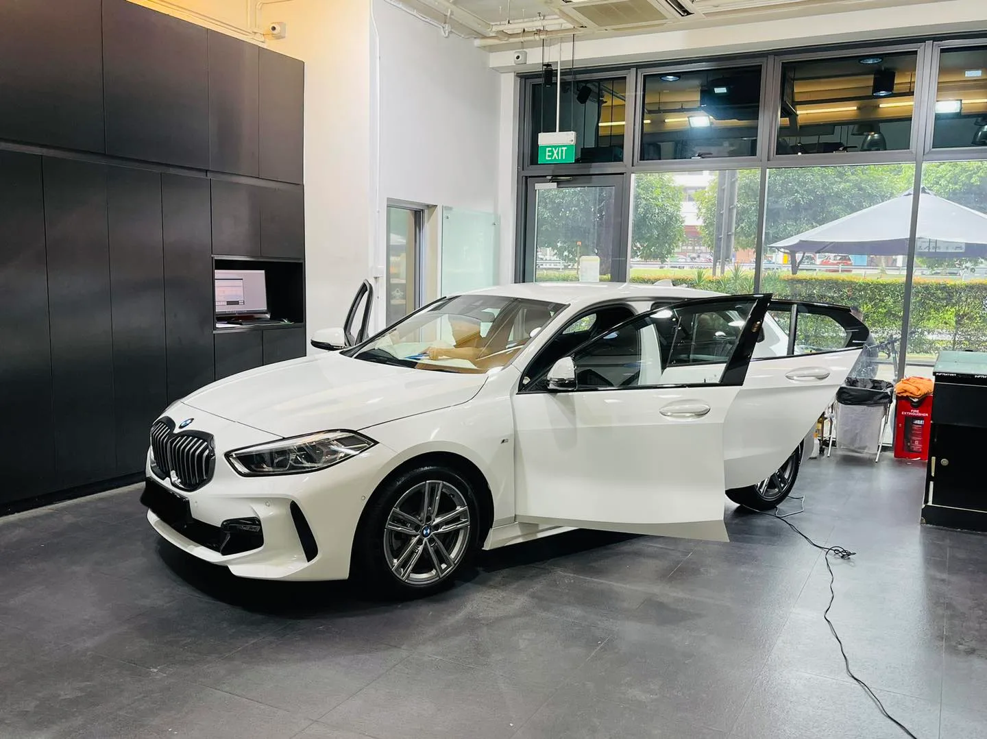 White BMW 1 Series at Infratint Singapore for window film installation