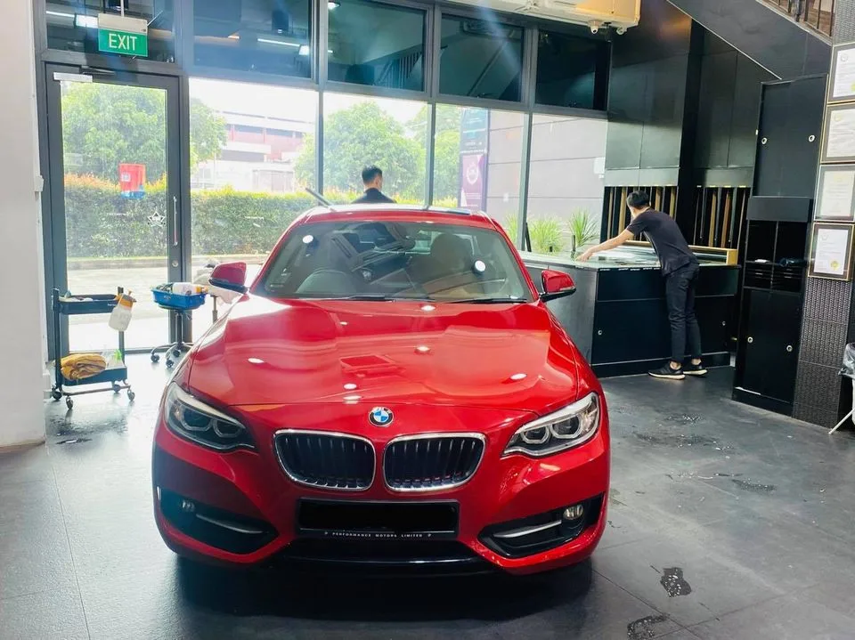 Red BMW 2 Series coupe inside the Infratint Singapore showroom for window tinting