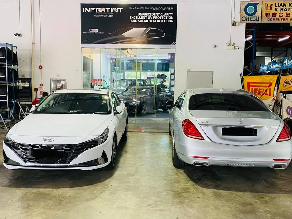 White Hyundai Avante and white Mercedes-Benz S-Class at Infratint Singapore for window film