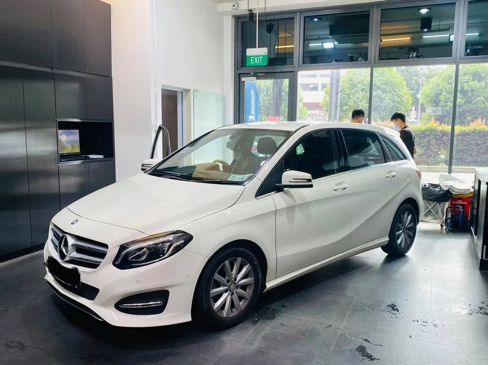 White Mercedes-Benz B-Class side view with door open at Infratint Singapore