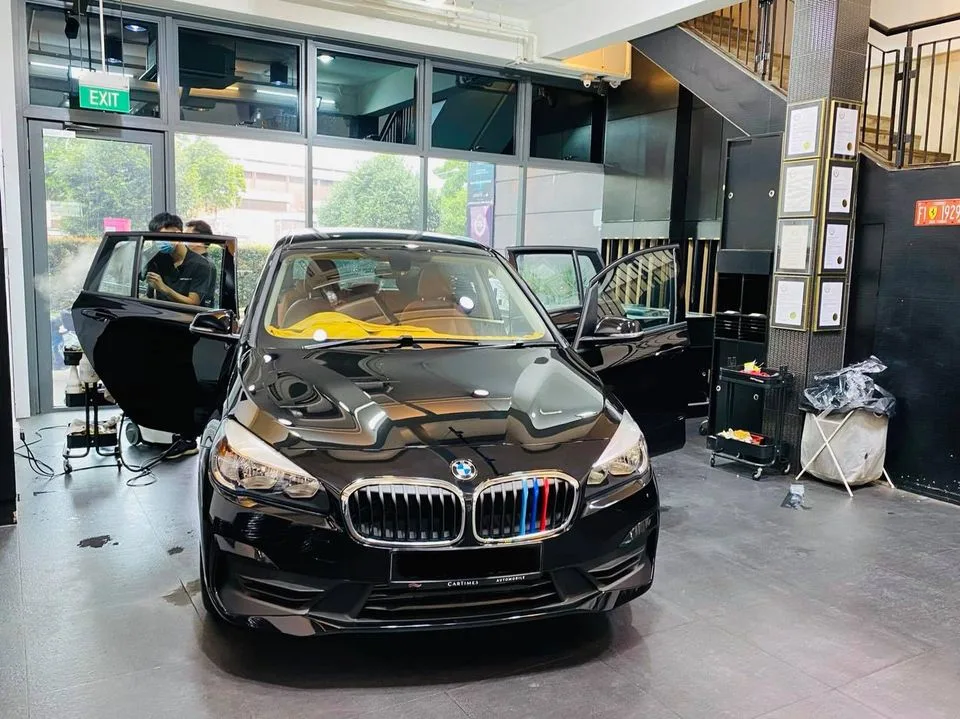 Black BMW 2 Series with M-stripe grille being tinted at Infratint Singapore
