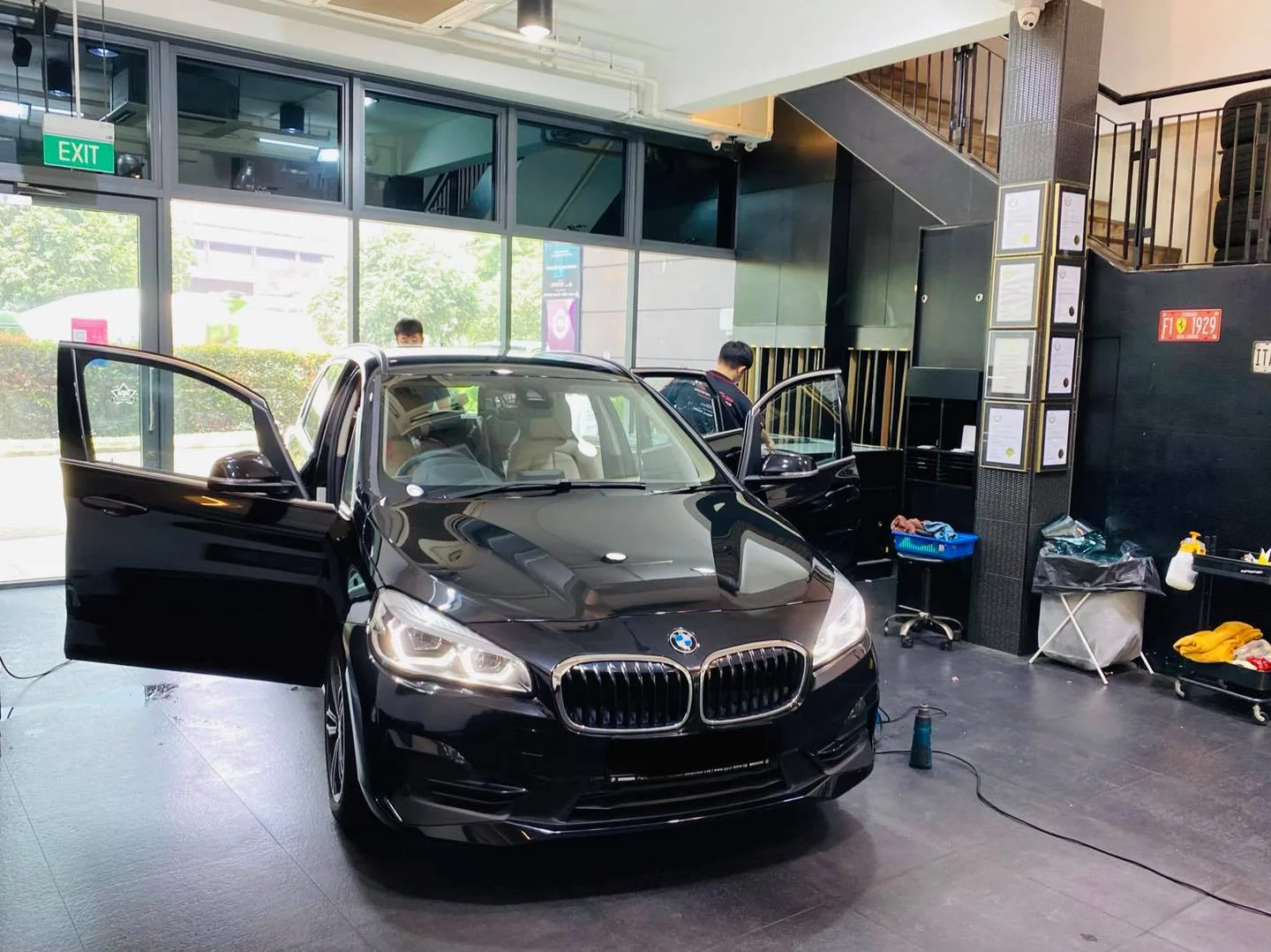 Black BMW with door open at Infratint Singapore during window tinting