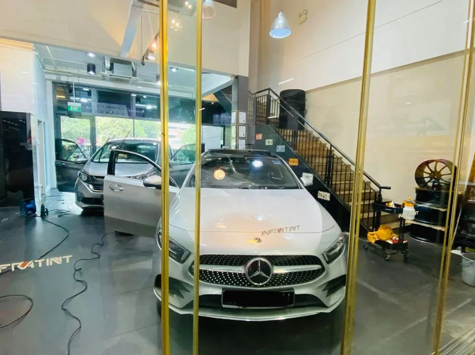 White Mercedes-Benz A-Class and silver Honda SUV at Infratint Singapore for window film