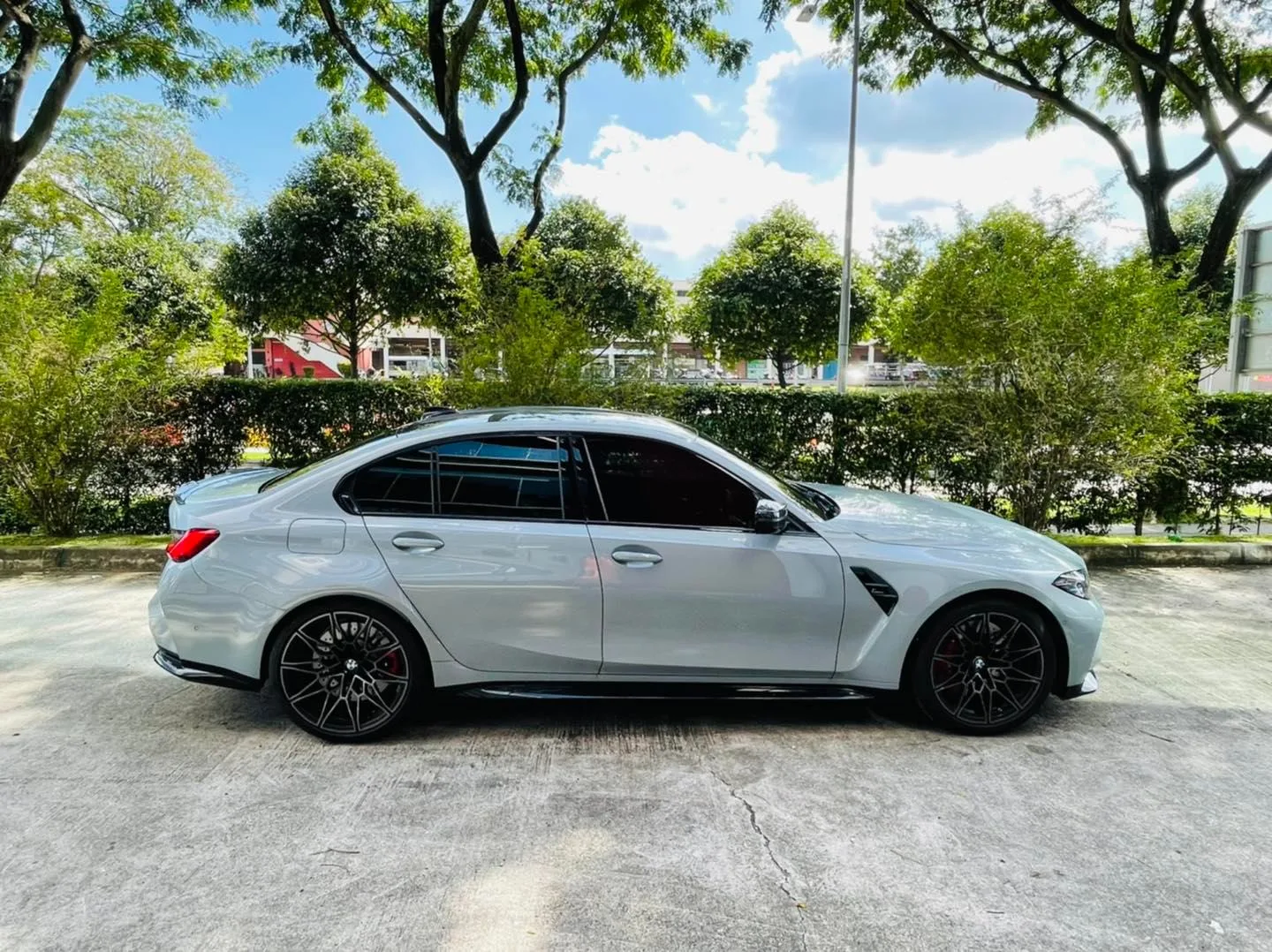 Grey BMW M3 side profile with tinted windows after Infratint Singapore install