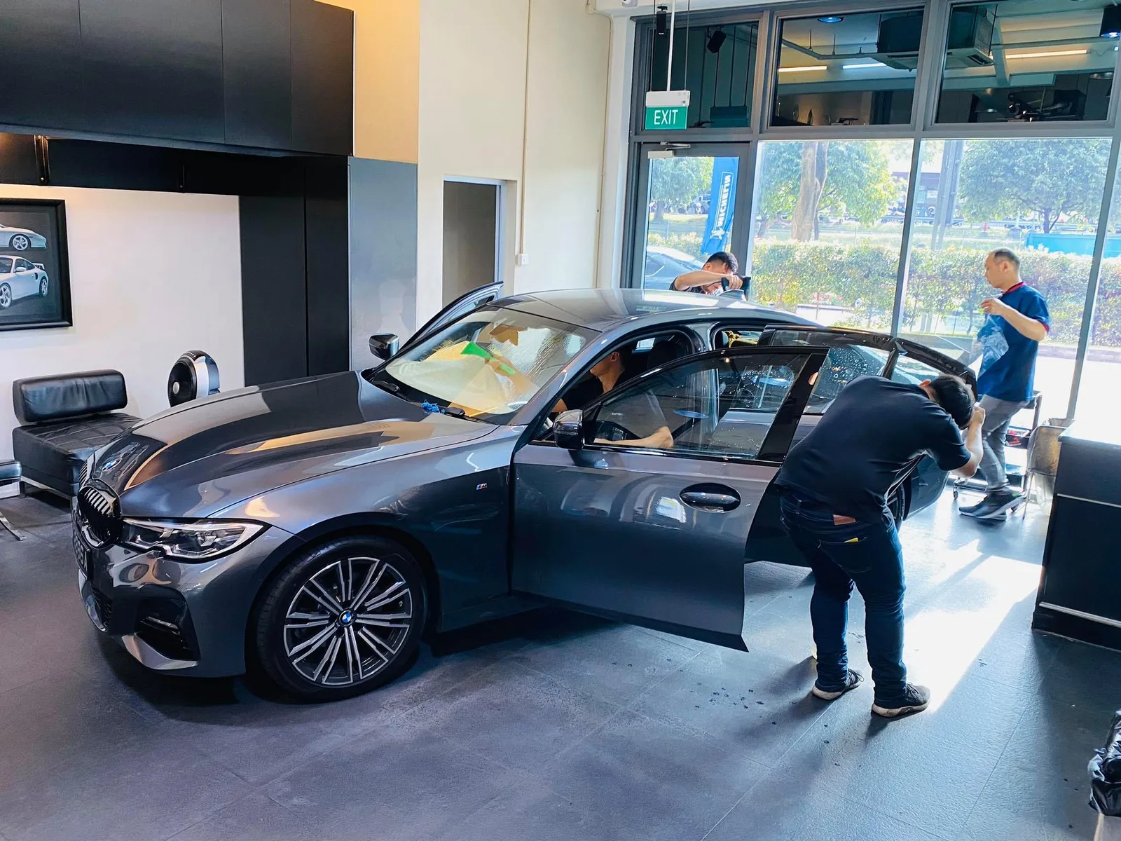 Grey BMW 3 Series side profile during a tint install at Infratint Singapore