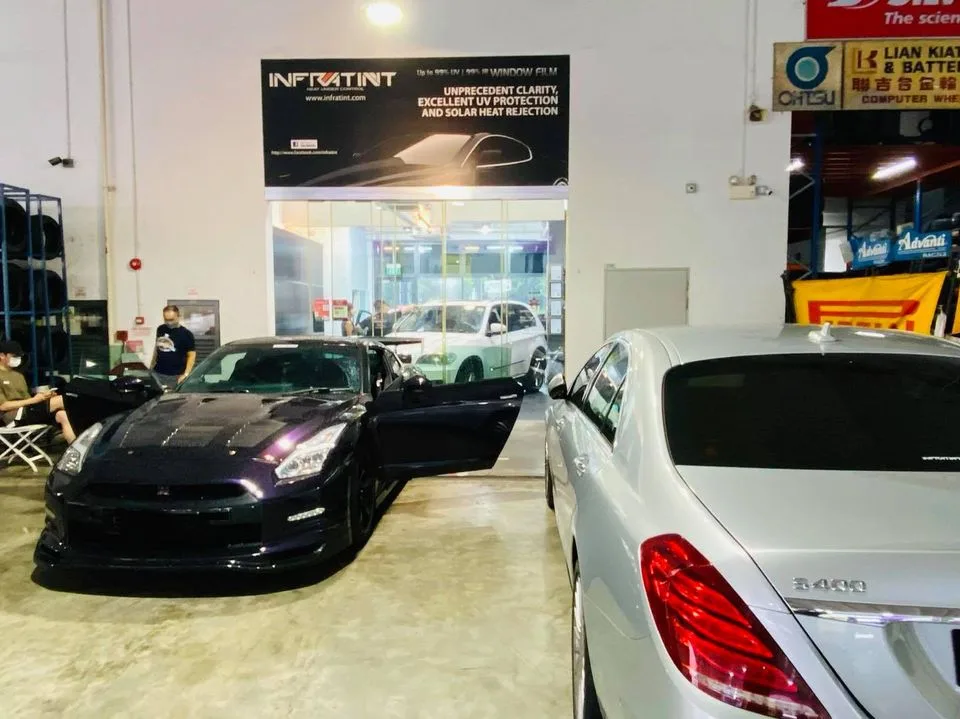 Dark purple Nissan GT-R and silver Mercedes-Benz S400 being tinted at Infratint Singapore