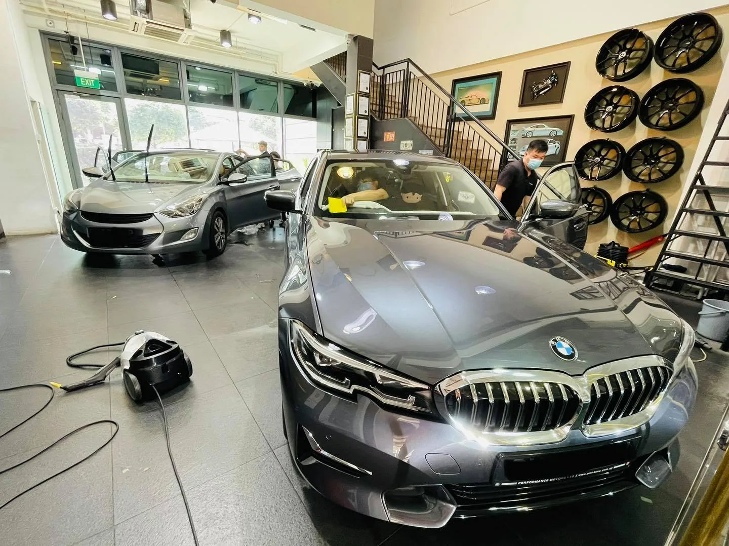 Grey BMW 3 Series and Hyundai Elantra being tinted at Infratint Singapore