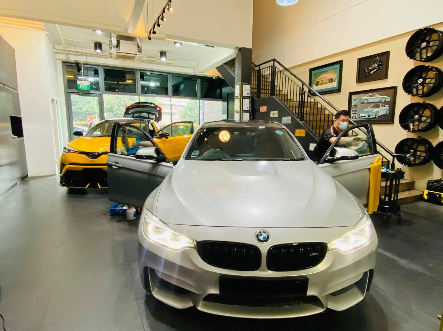 Silver BMW M coupe and yellow Toyota C-HR at Infratint Singapore window tinting workshop